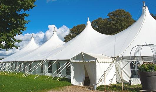 a line of sleek and modern portable restrooms ready for use at an upscale corporate event in Talent, OR